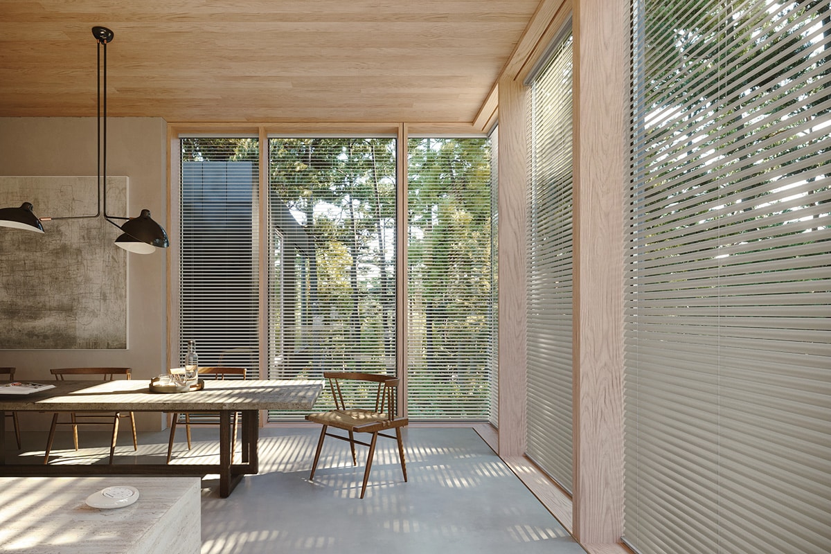 Aluminum blinds surrounding a dining room/kitchen area.